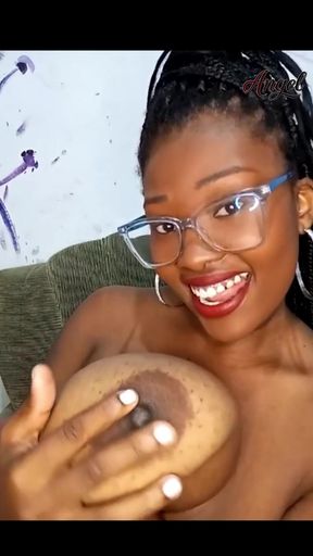 Sucking and shaking her own giant tits