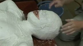 Asian teen mummification in plaster