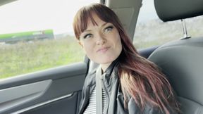 A Hitchhiker Plays with the Driver in the Front Seat