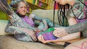 Tattooed lesbians hardcore stretching each other's holes with huge dildos.