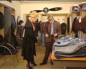 Two beautiful German chicks playing with a long strapon in the bedroom