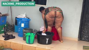 African Mama Multitasks on a Sunday Morning