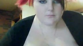 Ardent red haired BBW toys her bald vagina in front of webcam