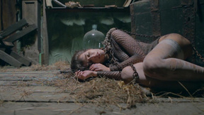 ”Chained slavegirl Emily J rams her cunt with a bottle”