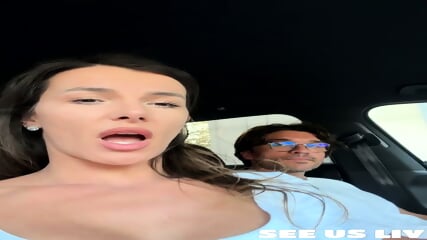 Sexy brunette babe plays with boyfriend's cock in car ride