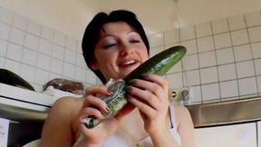 Small titted German chick sucking a cock and playing with a cucumber