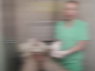 Gloved Nurse Sperm Extraction on Restrained Patient