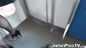 ”Japanese brunette close up peeing in train”