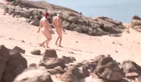couple threesome in a nudist beach