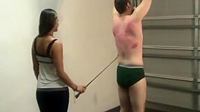 Mistresses Whipping The Money Slave :: Brunette Dominatrix Whip Punishment Scene