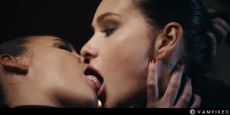 Tough vampire makes an obedient brunette lick her trimmed pussy