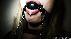 ”Ballgagged blonde Lucy Heart rams her booty with a glass dilco”