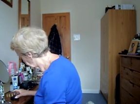 Wearing a blue skirt and flashing her tits