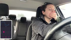 Horny brunette tries to drive a car with a vibrator inside her pussy