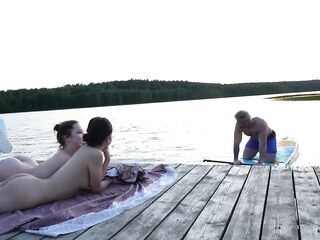 two Girls Took Their Clothing off on the Lake. a Passing Surfer Had Sex in the Open Air