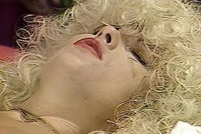 Busty blonde MILFs in lingerie and stockings having lesbian sex