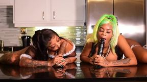 Two big booty maids take turns sucking on a big black dildo, giving each