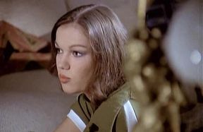 Beautiful Brigitte Lahaie shows hairy pussy on piano