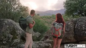 Feisty redhead Audrey Reid gives a horny blowjob outdoors